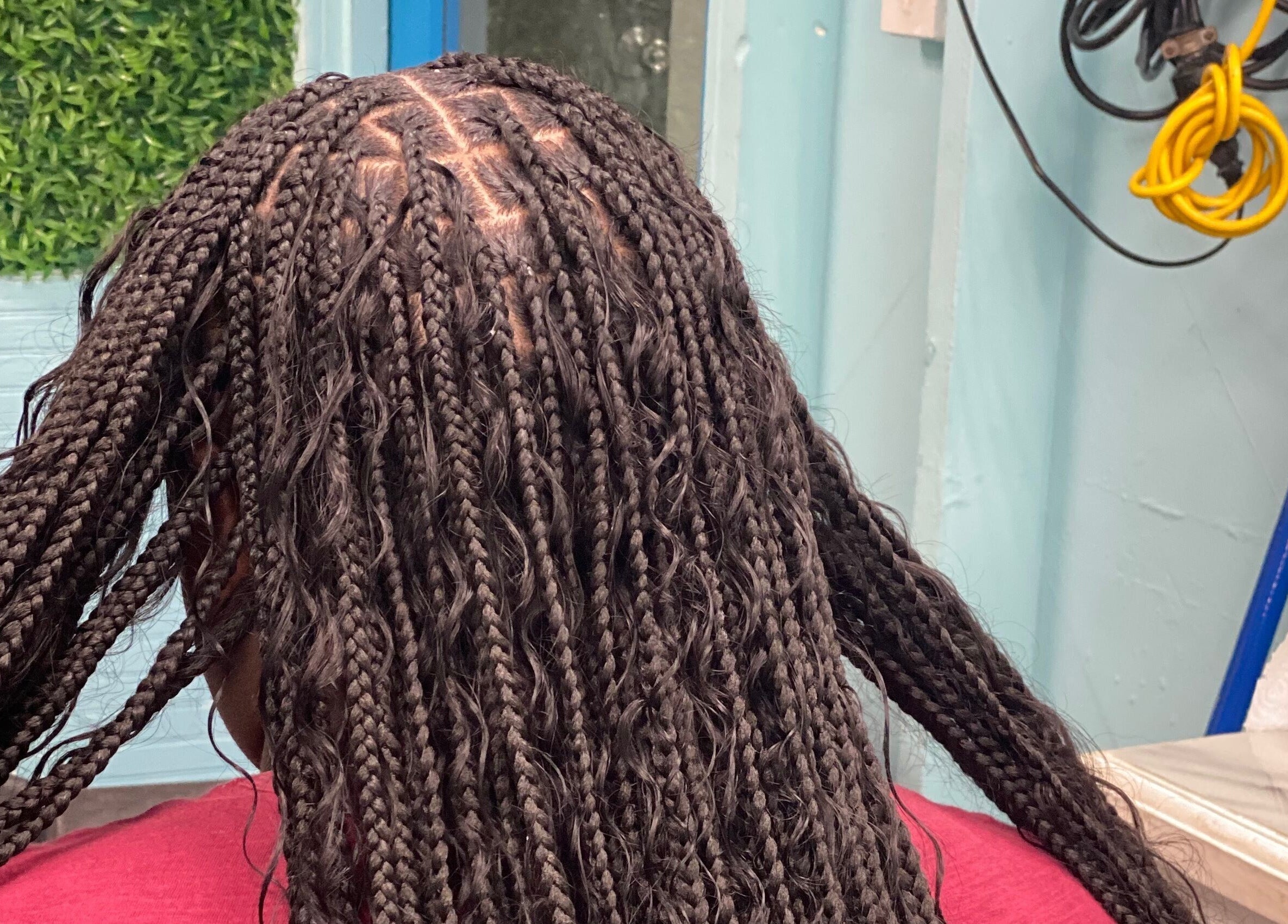 Intricate braids styled at DopexBraids, Bridgetown, Saint Michael, BB, showcasing expert hairstyling.