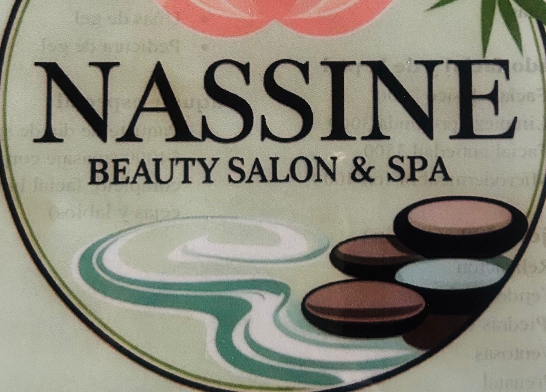 NASSINE Beauty Salon & Spa logo featuring calming stones and waves, located in Jarabacoa, La Vega, DO.