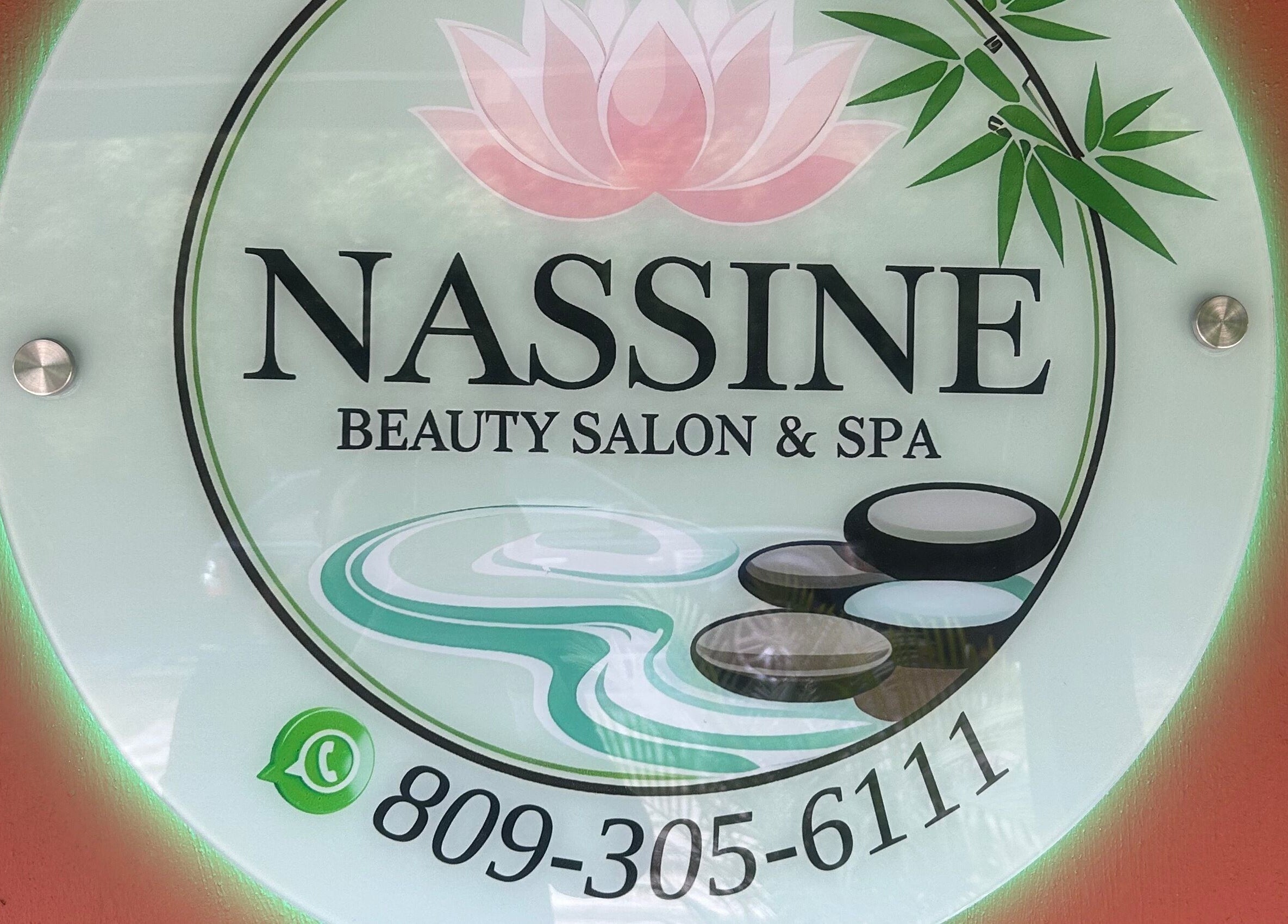 NASSINE Beauty Salon & Spa sign at Jarabacoa, La Vega, DO, featuring a lotus and bamboo design.