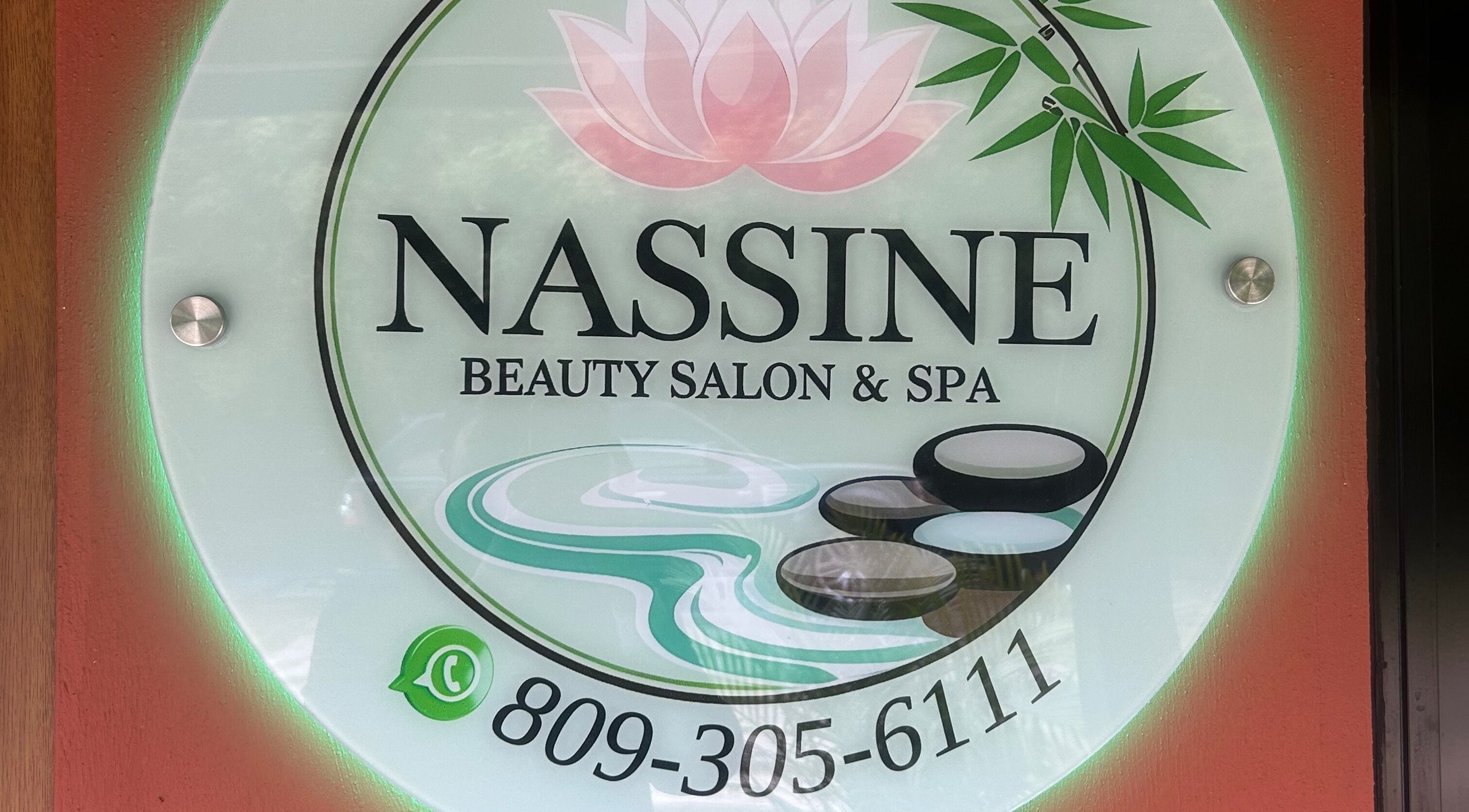 NASSINE Beauty Salon & Spa sign at Jarabacoa, La Vega, DO, featuring a lotus and bamboo design.