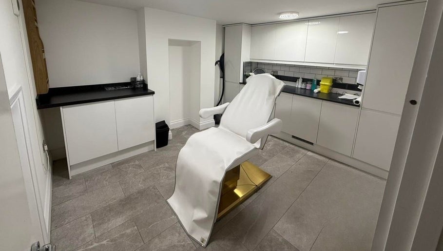 Modern treatment room at Allure Skin & Aesthetics, Sittingbourne, England, GB, featuring a sleek white chair.
