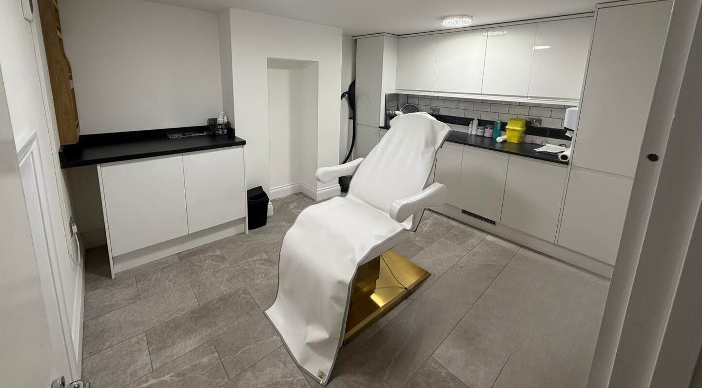 Modern treatment room at Allure Skin & Aesthetics, Sittingbourne, England, GB, featuring a sleek white chair.