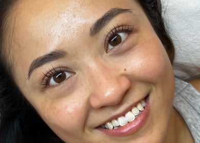Happy client showing off lash enhancements at She Got Brow & Lash Beauty Studio, Toronto, Ontario, CA.