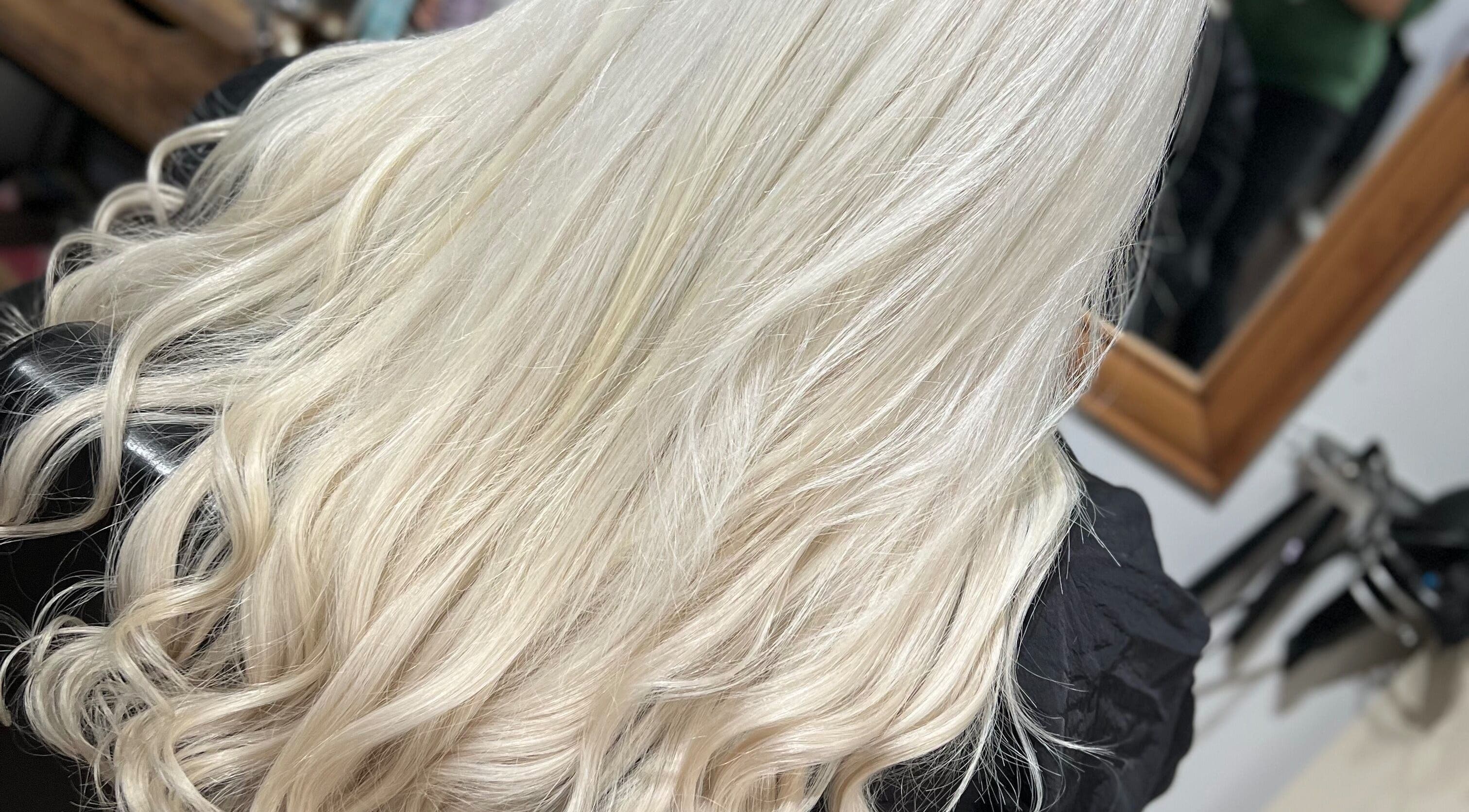 Blonde wavy hair styled at David Charles Hair & Beauty Studio, Northampton, England, GB.