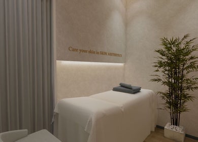 Relaxing treatment room at Bangs Prime Skin Aesthetics in Makati City, Metro Manila, PH, with cozy decor.