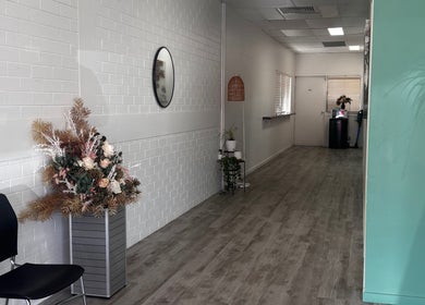 Interior hallway with floral decor at Roxanne Mae's RMT Torquay, Queensland, AU, offering a tranquil ambiance.