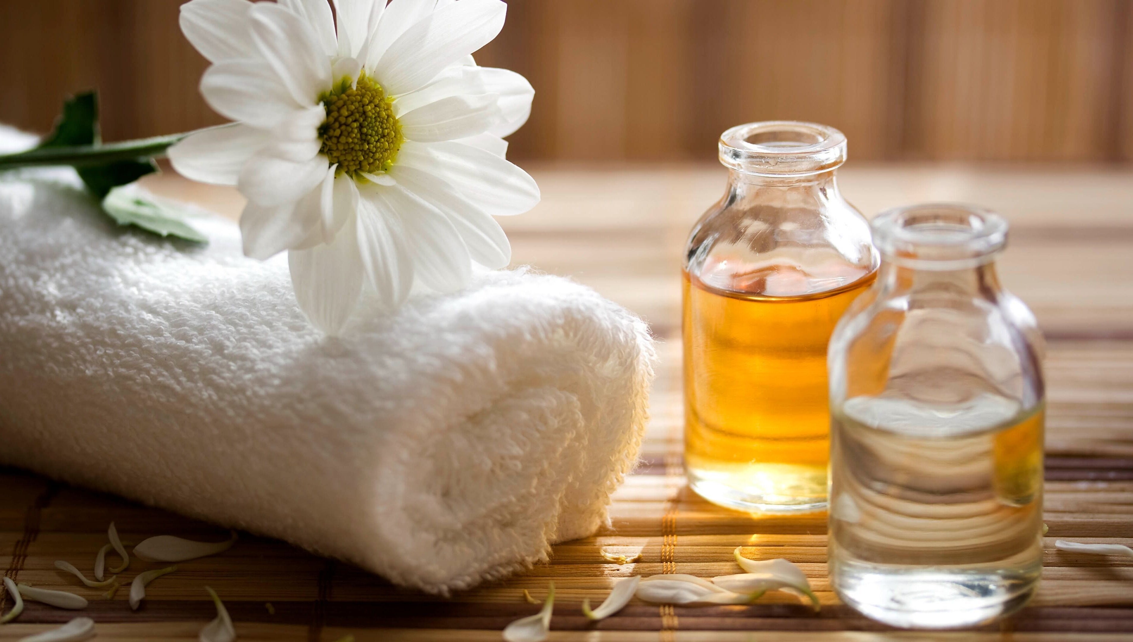 Calm Spa in Austin, Texas offers a serene setting with a cozy towel and essential oils for relaxation.