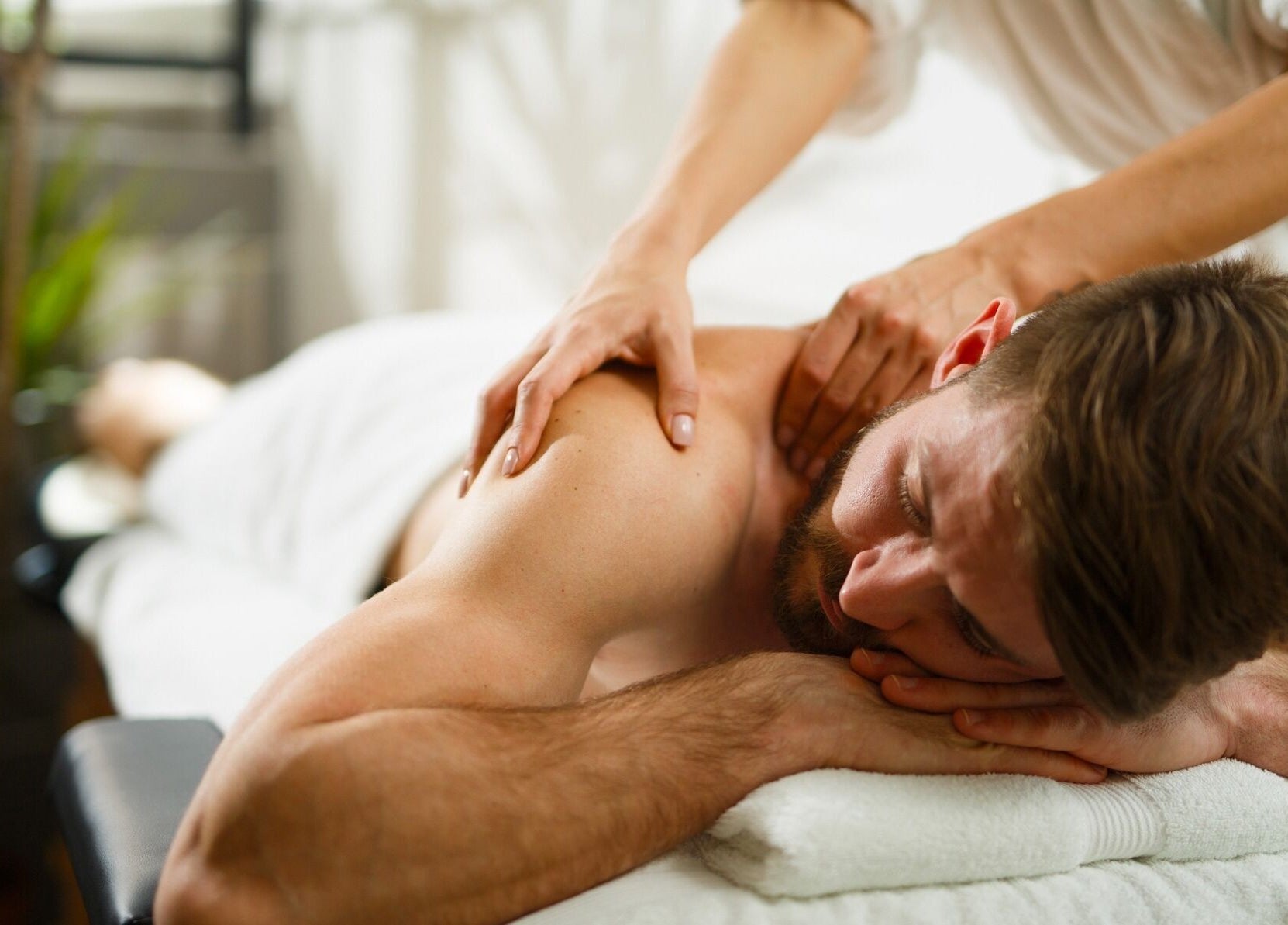 Relaxing massage session at Calm Spa, Austin, Texas, US, providing soothing wellness experience.