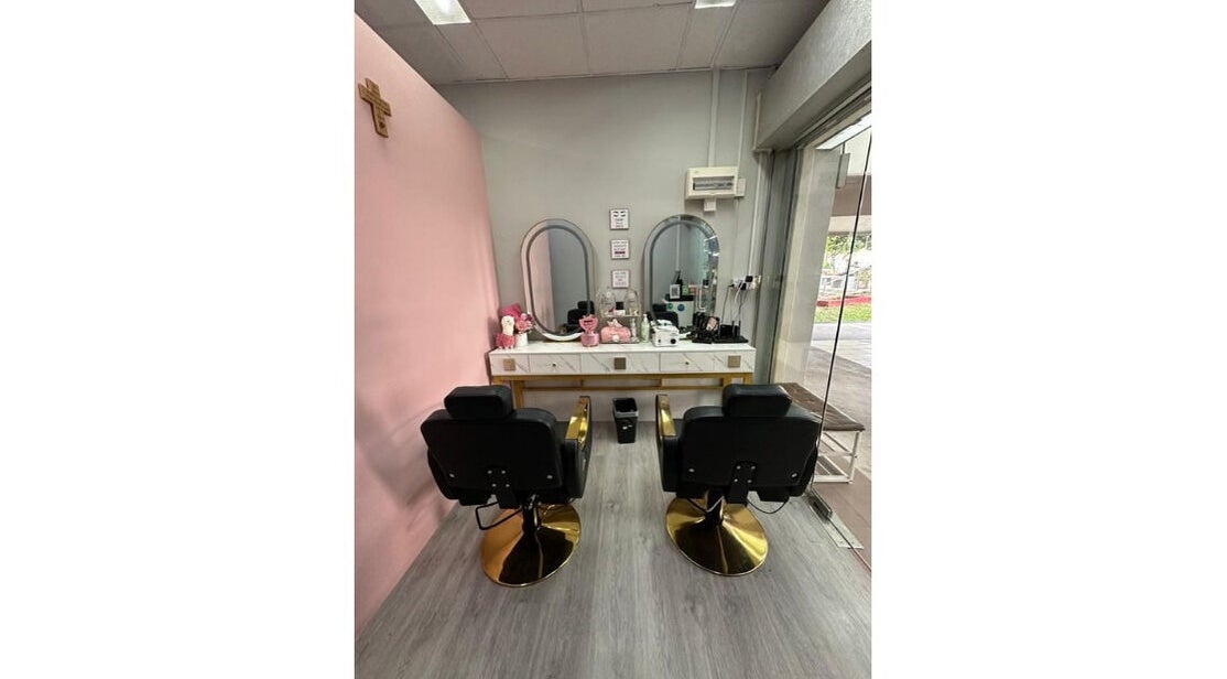Elegant salon chairs and mirrors at Becca's Beautique, Singapore, SG. Modern pink and gray interior design.