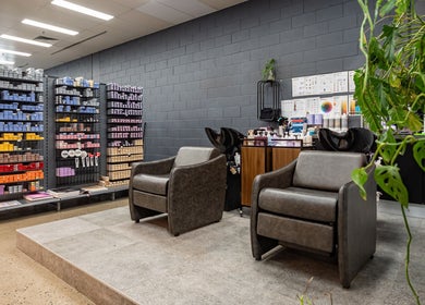 Stylish salon area at ATSI Hair Supplies in Brookvale, New South Wales, AU with chairs and hair products.