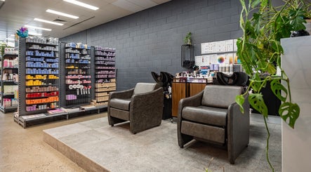 Stylish salon area at ATSI Hair Supplies in Brookvale, New South Wales, AU with chairs and hair products.