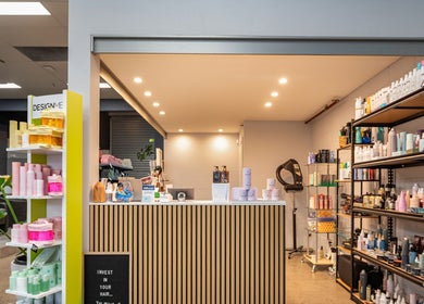 ATSI Hair Supplies reception area in Brookvale, New South Wales, AU, featuring shelves with hair products.