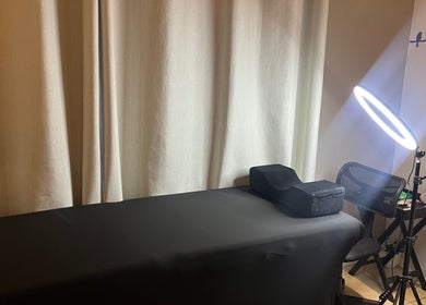 Massage table with soft lighting at Bellah Beauty Bar, Cape Town, Western Cape, ZA.