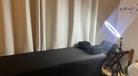 Massage table with soft lighting at Bellah Beauty Bar, Cape Town, Western Cape, ZA.