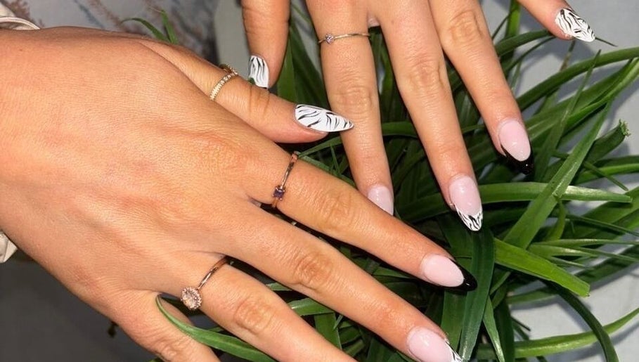 Stylish zebra manicure at Modern Glow Mc, Gillitts, Kwazulu-natal, ZA showcasing unique nail art design.