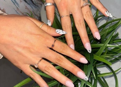 Stylish zebra manicure at Modern Glow Mc, Gillitts, Kwazulu-natal, ZA showcasing unique nail art design.