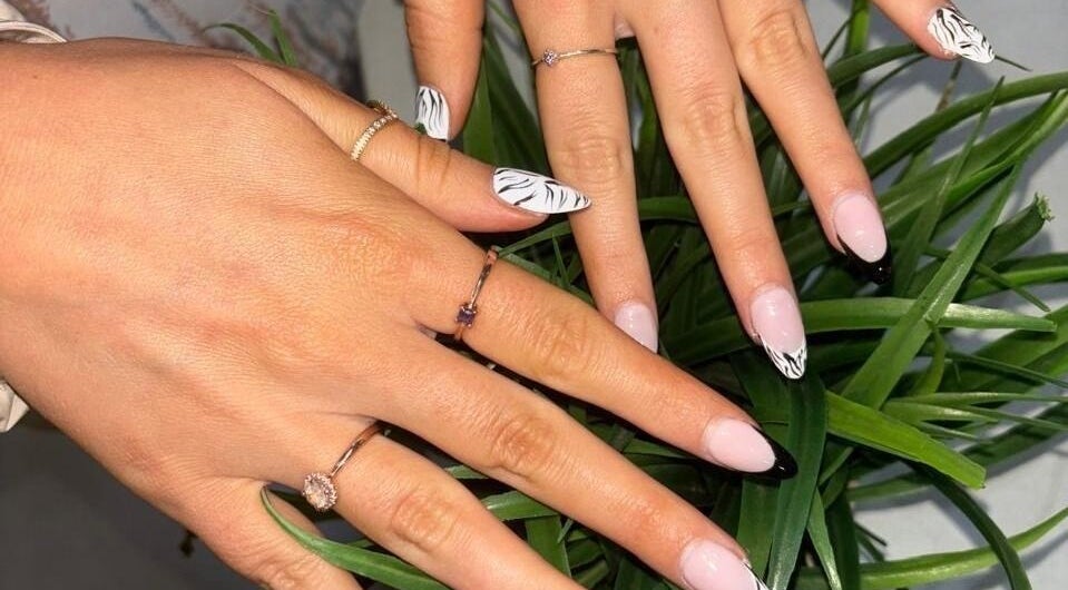 Stylish zebra manicure at Modern Glow Mc, Gillitts, Kwazulu-natal, ZA showcasing unique nail art design.