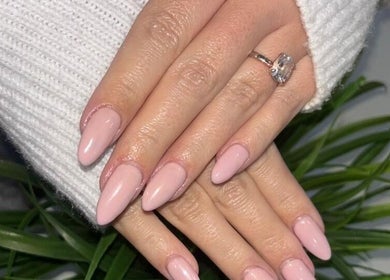 Close-up of manicured hands with soft pink nails at Modern Glow Mc, Gillitts, Kwazulu-natal, ZA.