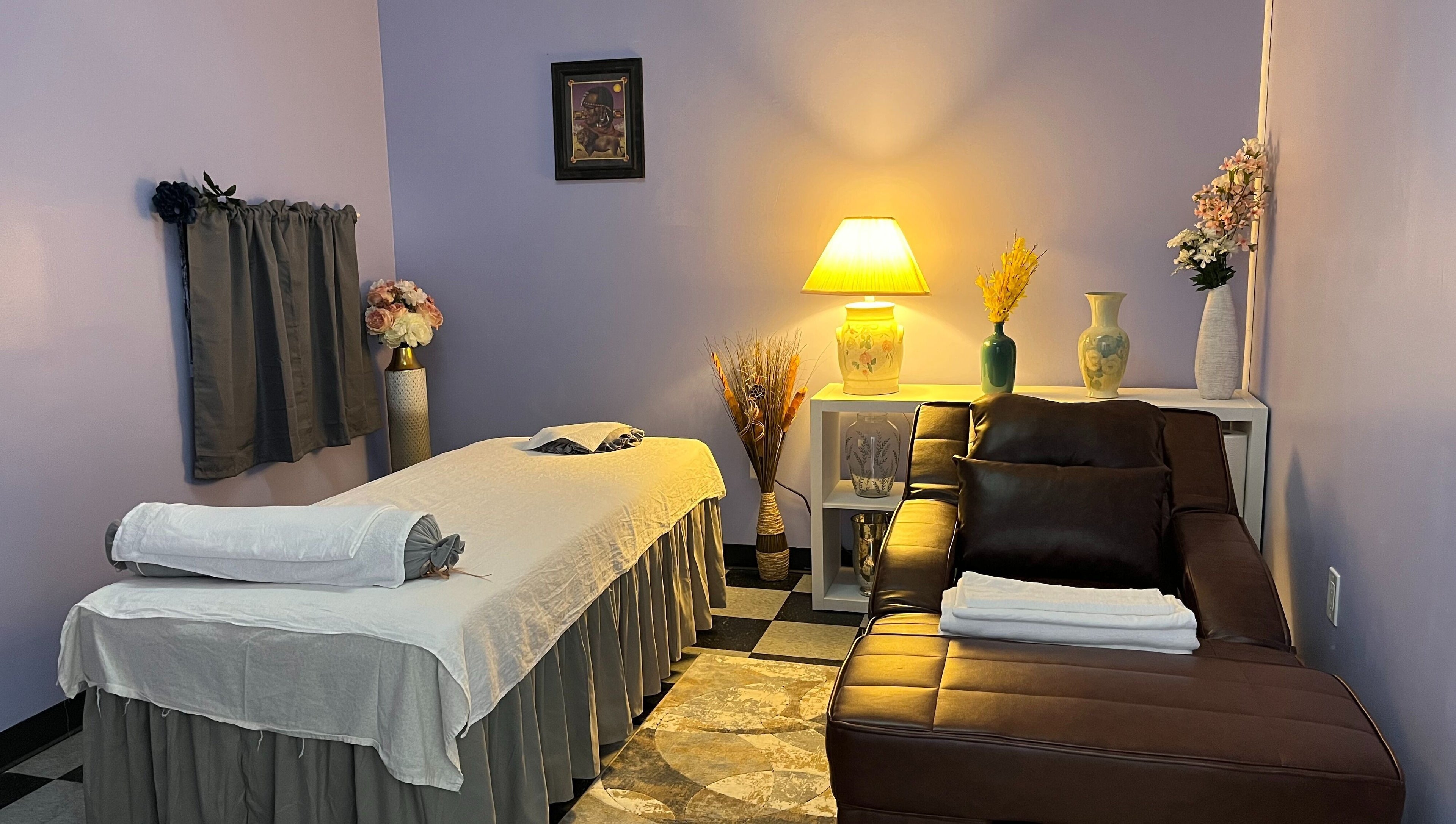 Relaxing massage room at Emma's Sunflower Spa, New Windsor, New York, US with cozy lighting and décor.