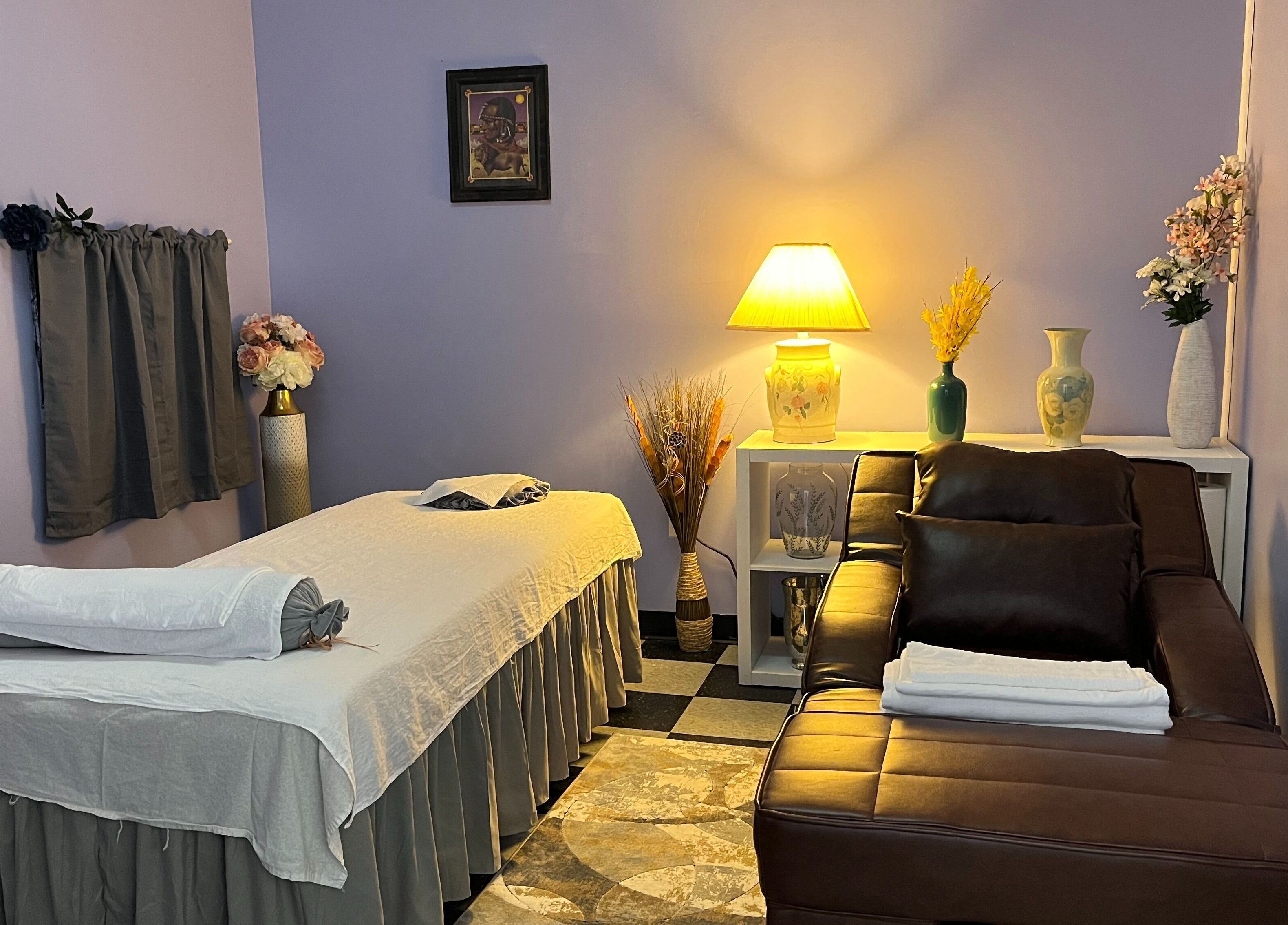 Relaxing massage room at Emma's Sunflower Spa, New Windsor, New York, US with cozy lighting and décor.