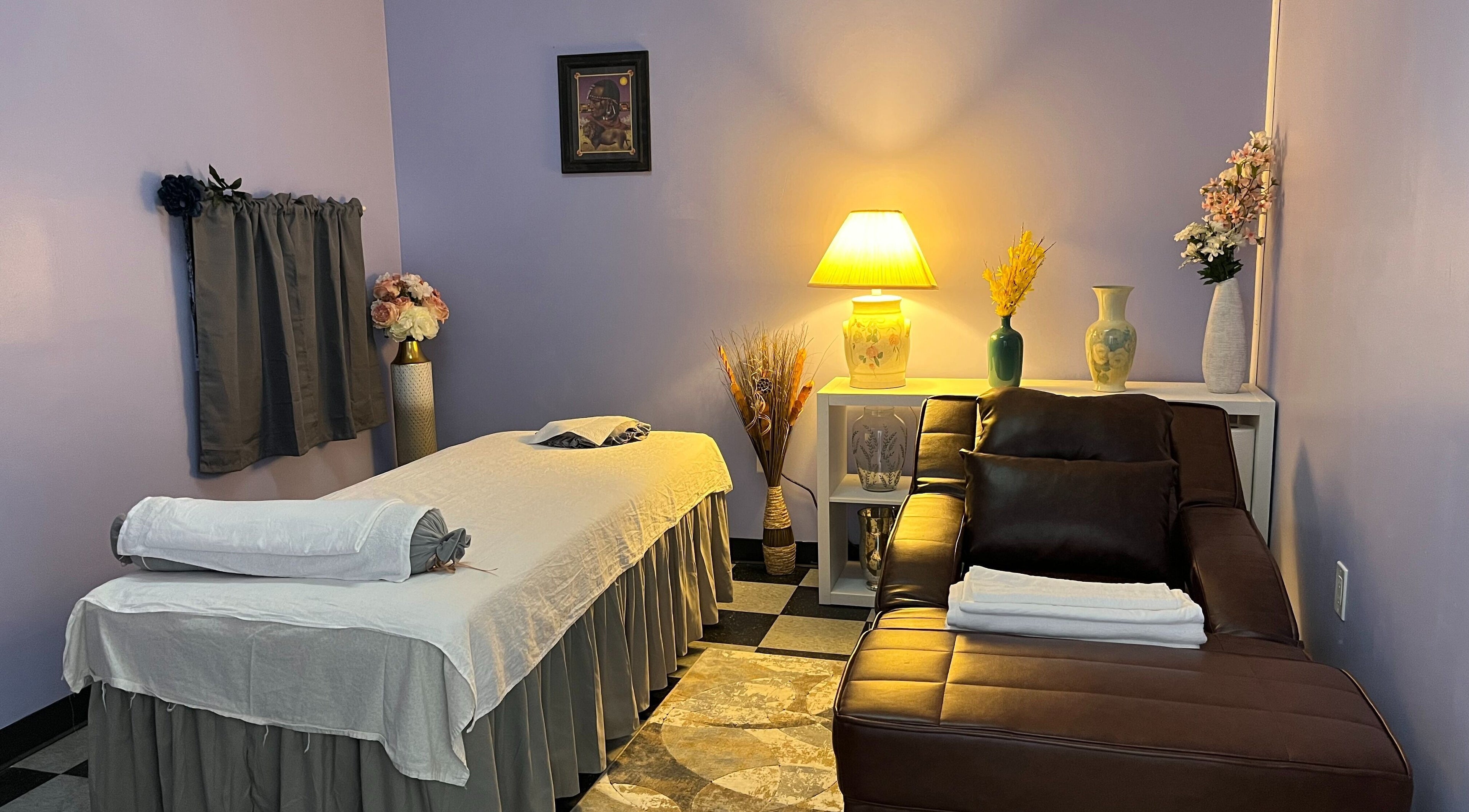 Relaxing massage room at Emma's Sunflower Spa, New Windsor, New York, US with cozy lighting and décor.