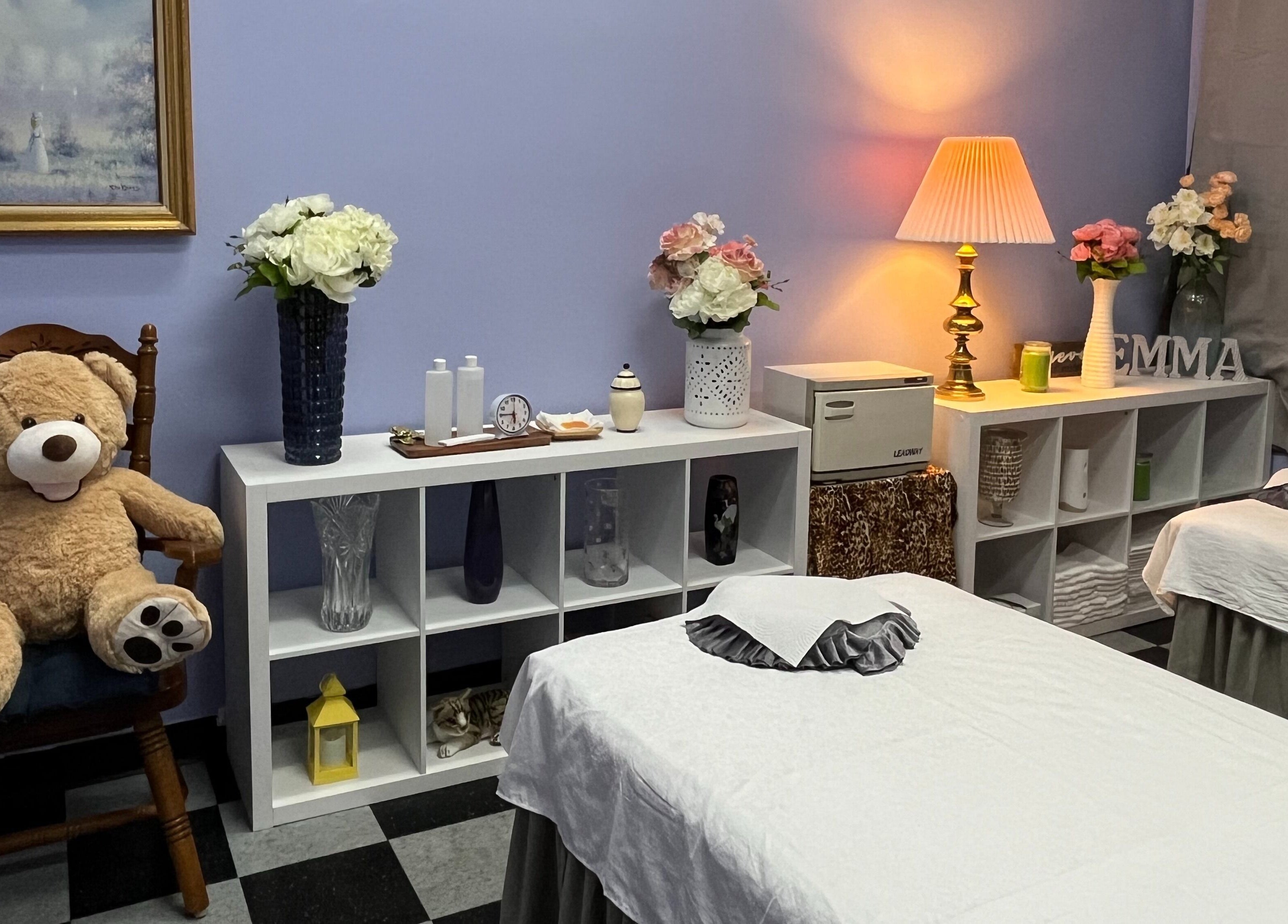 Inner view of Emma's Sunflower Spa, New Windsor, New York, US, featuring treatment tables and decor.