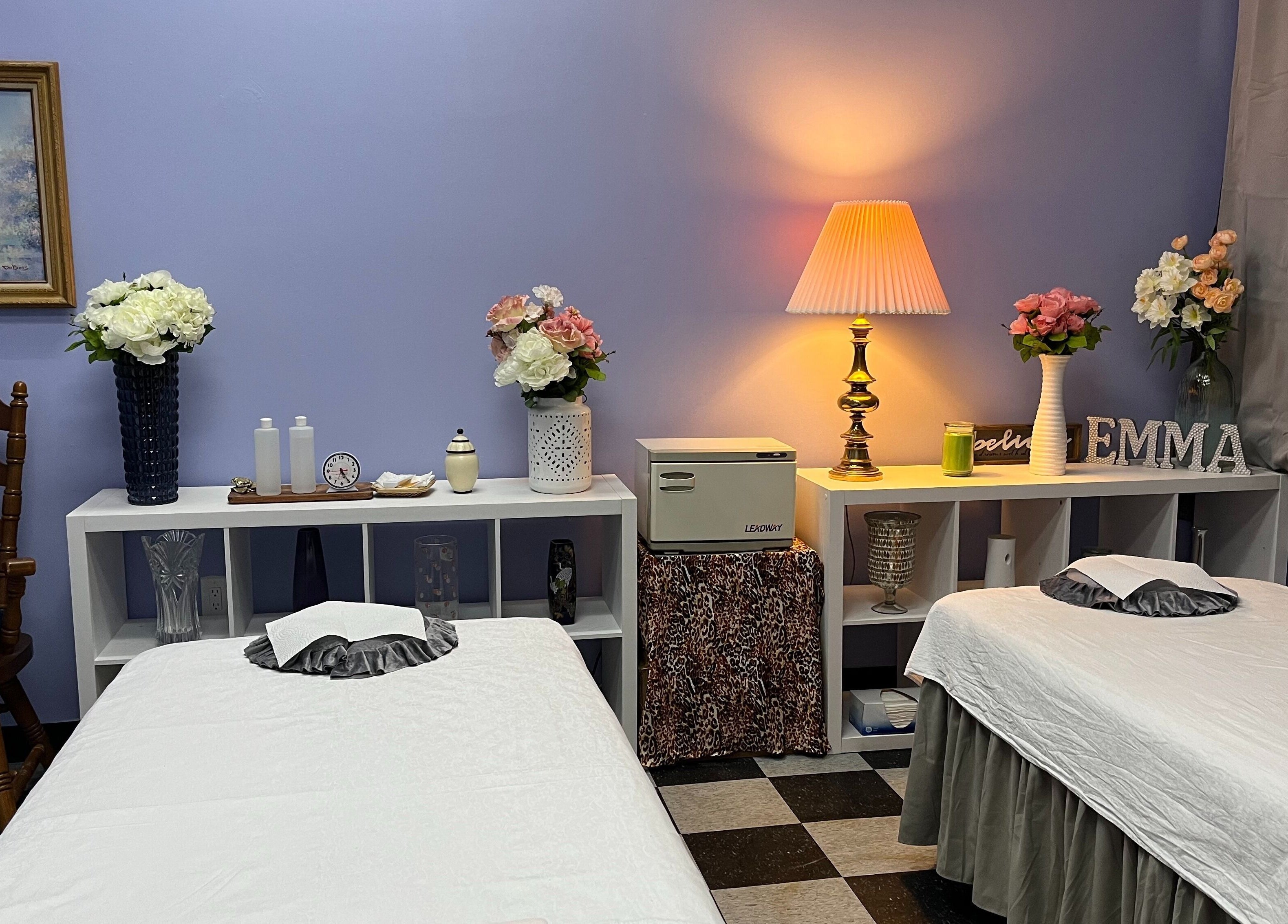 Cozy treatment room at Emma's Sunflower Spa in New Windsor, New York, US with elegant decor and soft lighting.