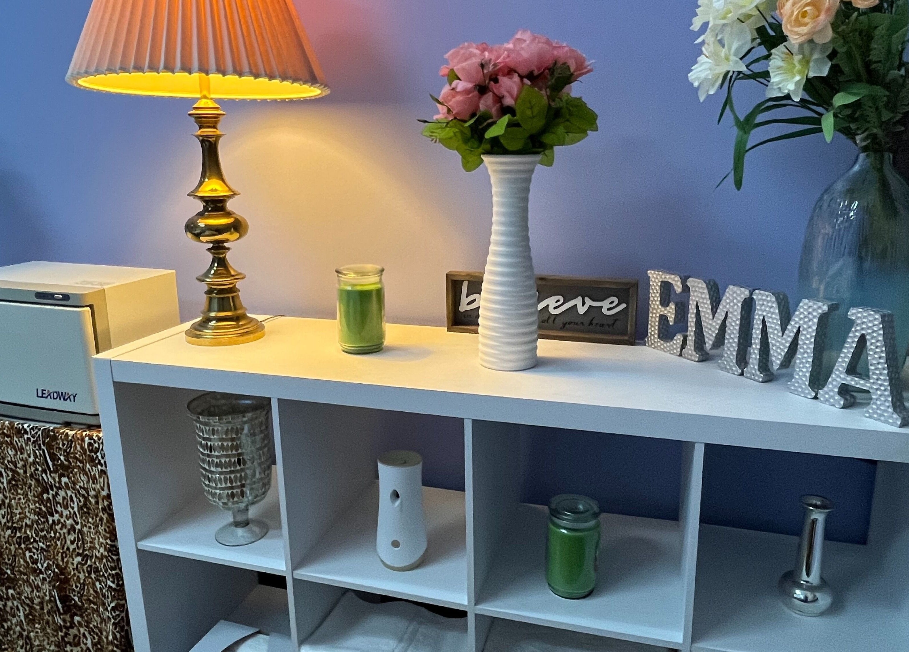Elegant shelf with lamp and flowers at Emma's Sunflower Spa, New Windsor, New York, US.