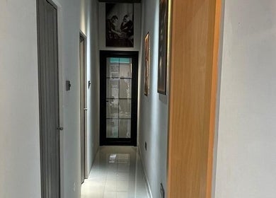 Bright hallway at Al Shahid Salon, Dubai, Dubai, AE, showcasing sleek modern decor.