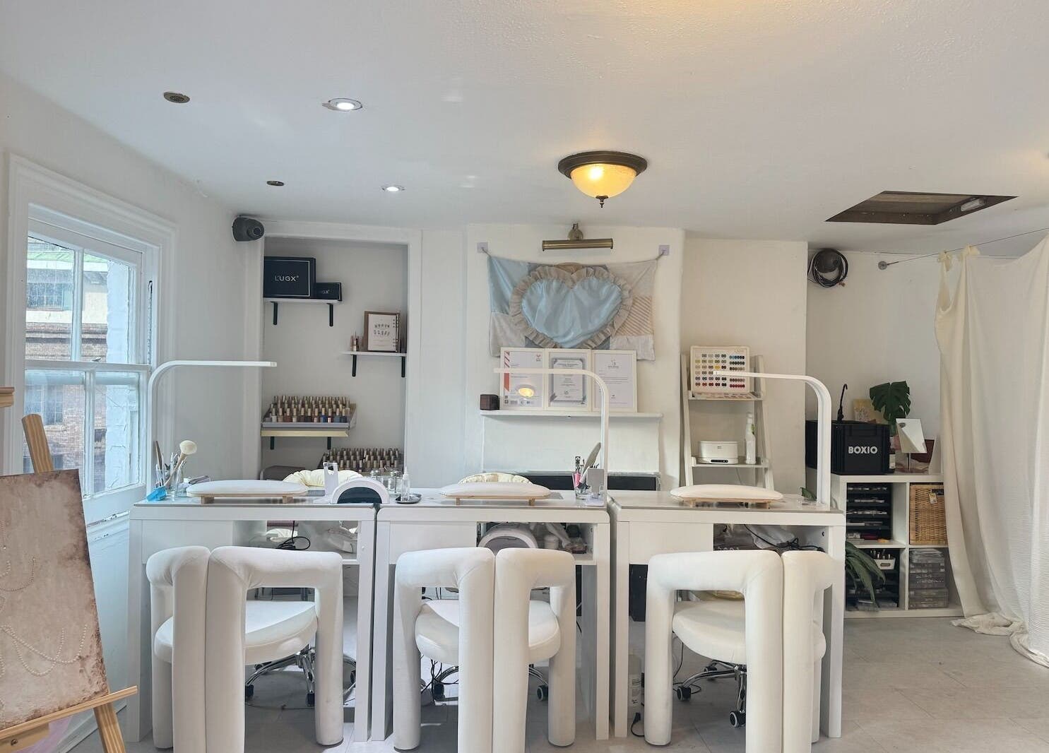 Interior of Shervie Art Studio featuring elegant white decor in London, England, GB.