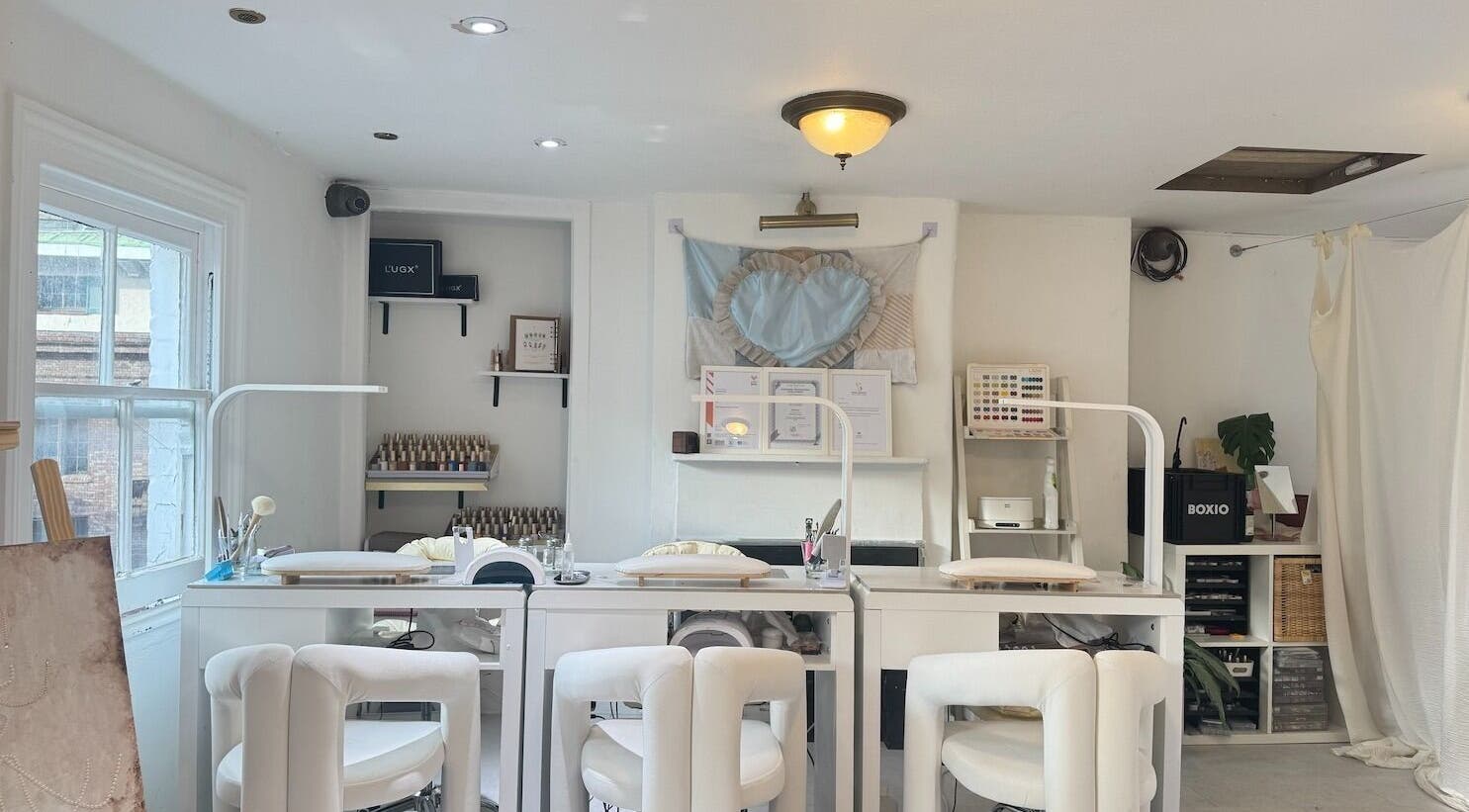 Interior of Shervie Art Studio featuring elegant white decor in London, England, GB.