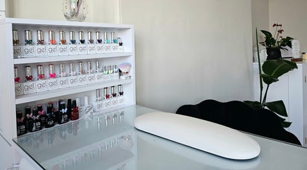 Modern nail polish display at E R Beauty Therapy, Plymouth, England, GB. Sleek and organized shelves.