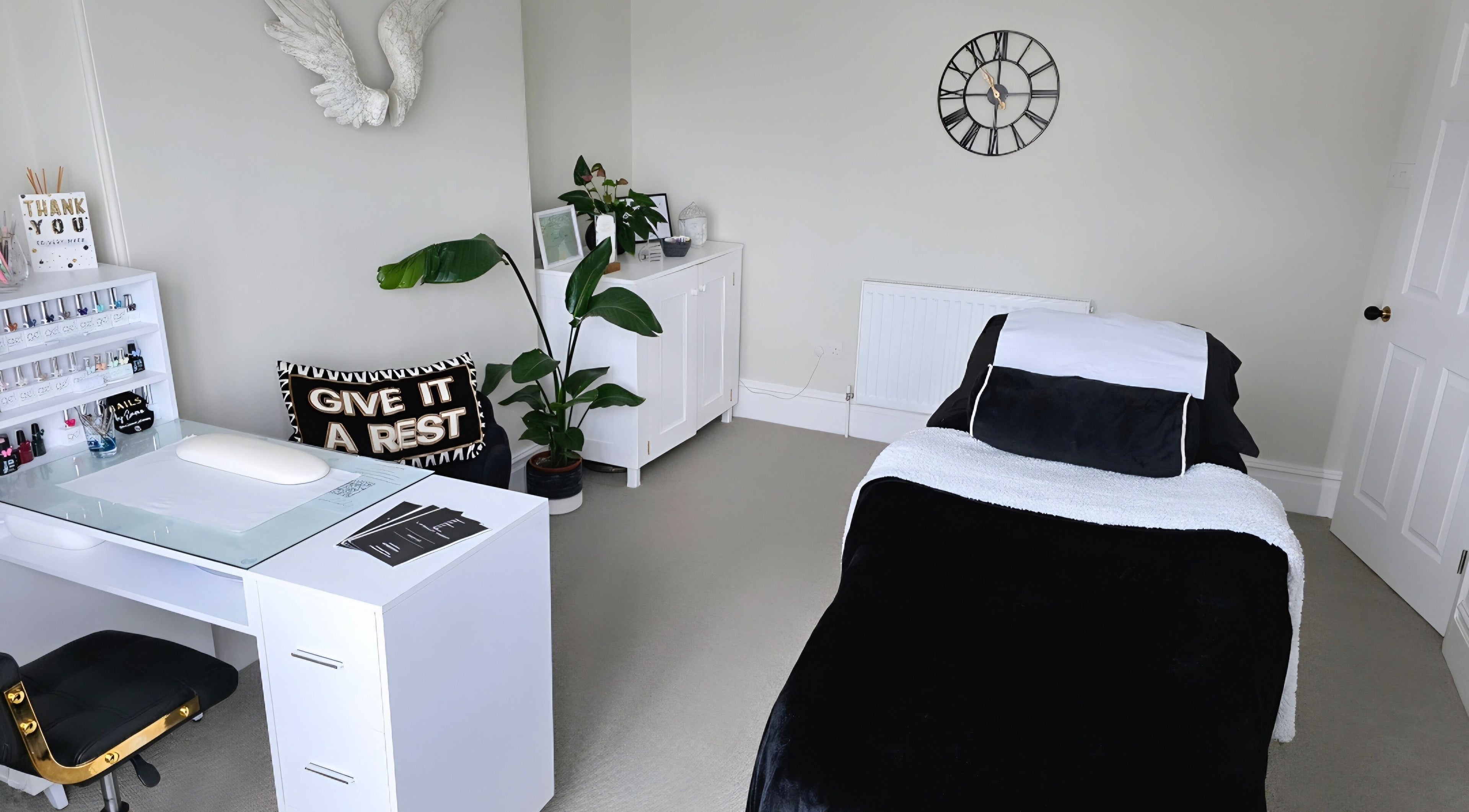 Relaxing therapy room at E R Beauty Therapy, Plymouth, England, GB with modern decor and treatment bed.