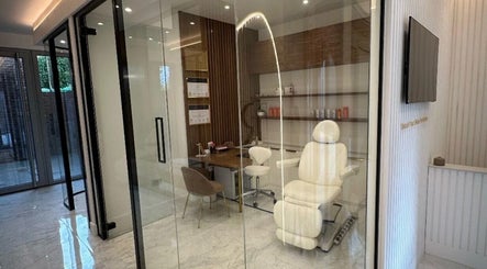 Modern treatment room at Skin. London, England, GB with sleek design and comfortable seating.