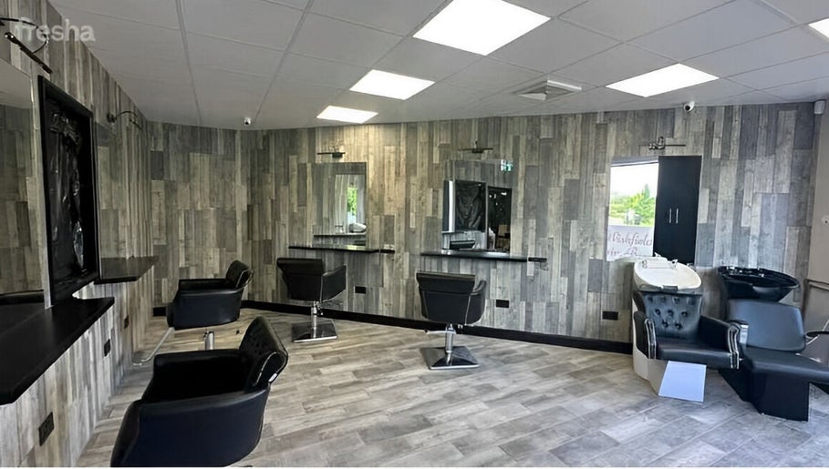 Modern chic salon interior at Kiera’s Kreations in Bognor Regis, England, GB. Stylish chairs and sleek design.