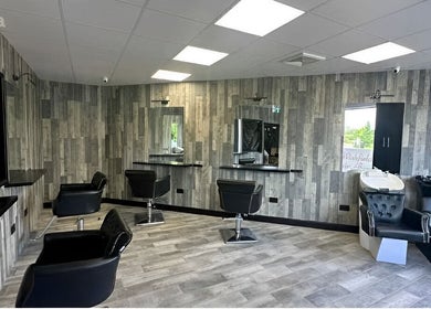 Modern chic salon interior at Kiera’s Kreations in Bognor Regis, England, GB. Stylish chairs and sleek design.
