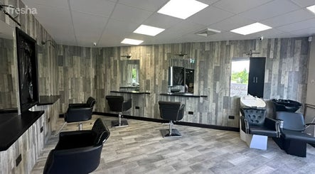 Modern chic salon interior at Kiera’s Kreations in Bognor Regis, England, GB. Stylish chairs and sleek design.