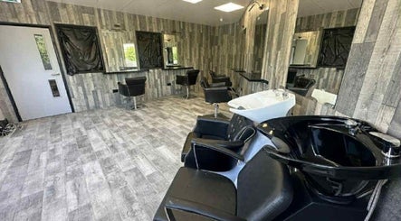 Modern hair salon interior at Kiera’s Kreations in Bognor Regis, England, GB, featuring sleek styling stations.