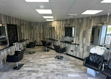 Modern salon interior at Kiera’s Kreations in Bognor Regis, England, GB featuring sleek styling chairs and mirrors.
