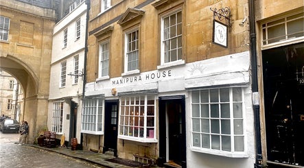 Charming street view of Manipura House, a wellness venue in Bath, England, GB with classic architecture.