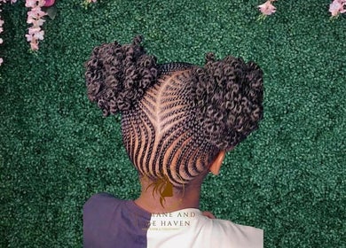 Intricate braided hairstyle at The Mane & Tame Haven, Dieppe Bay, KN.