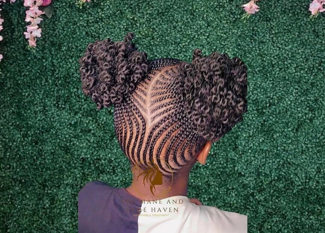 Intricate braided hairstyle at The Mane & Tame Haven, Dieppe Bay, KN.