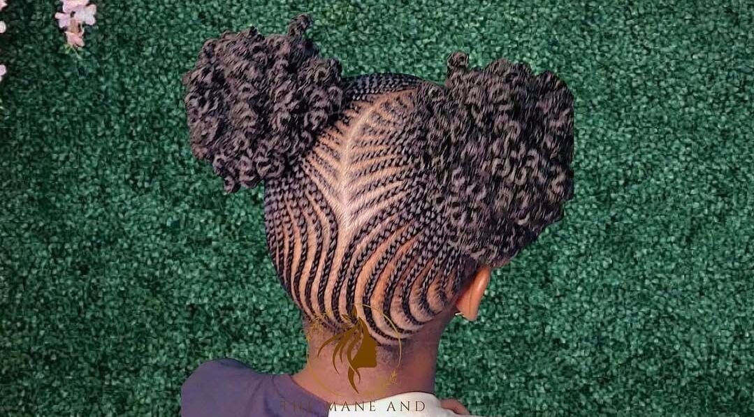 Intricate braided hairstyle at The Mane & Tame Haven, Dieppe Bay, KN.