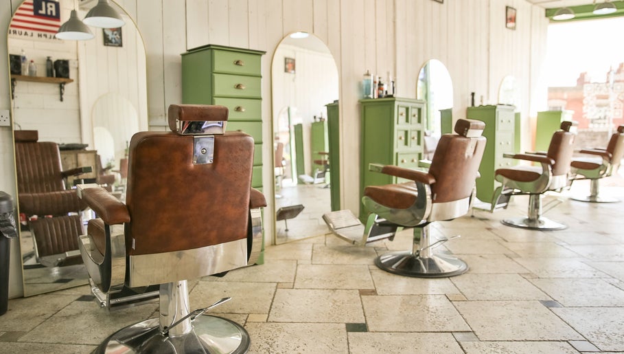 Chic barber chairs at Jacobs Perry Road in Bristol, England, offering a vintage-style salon ambiance.