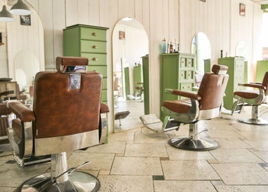 Chic barber chairs at Jacobs Perry Road in Bristol, England, offering a vintage-style salon ambiance.