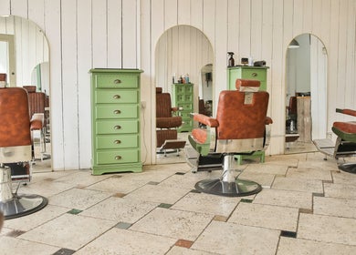 Vintage salon chairs with green dressers at Jacobs Perry Road, Bristol, England, GB.