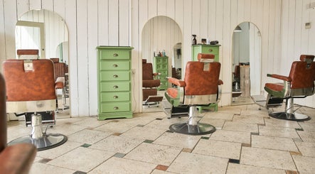 Vintage salon chairs with green dressers at Jacobs Perry Road, Bristol, England, GB.
