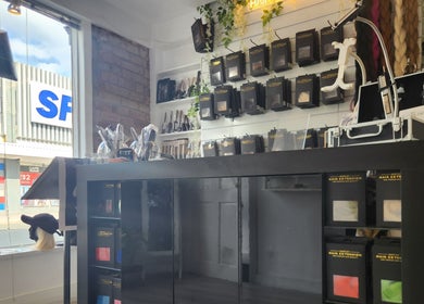 Stylish interior of Hartley Mee Ltd in Southport, England, GB, featuring a variety of hair extension products.