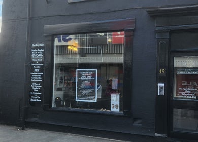 Exterior of Hartley Mee Ltd showing promotional offers in Southport, England, GB.