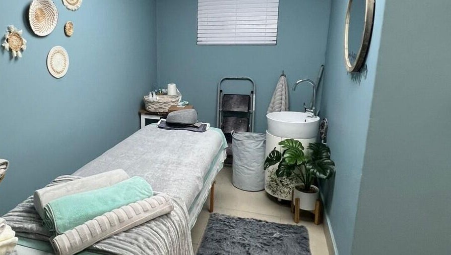 Peaceful treatment room at Treasured Moments in Gillitts, Kwazulu-Natal, ZA with cozy bed and calming decor.